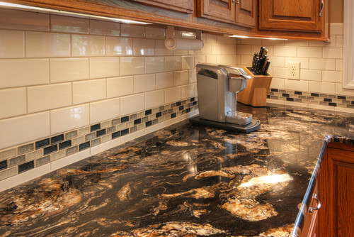 Titanium Granite with White Ceramic Subway and Glass Mosaic Tiles and Cherry Cabinets